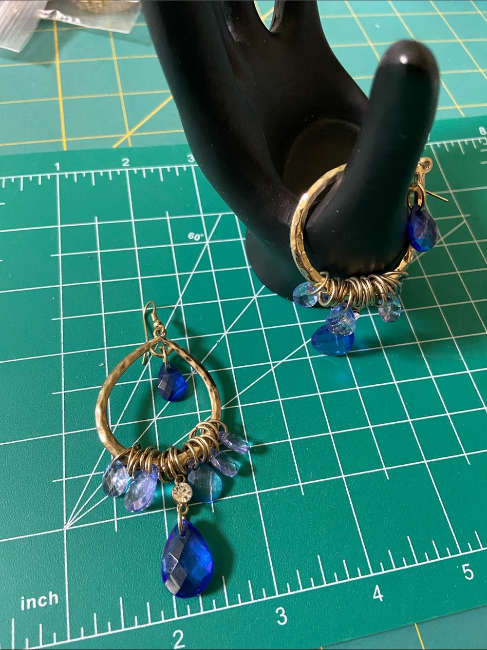 Gold tone Teardrop Hoop Earrings with Blue Crystal Dangles